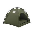 Green tent with a pillow inside on a white background