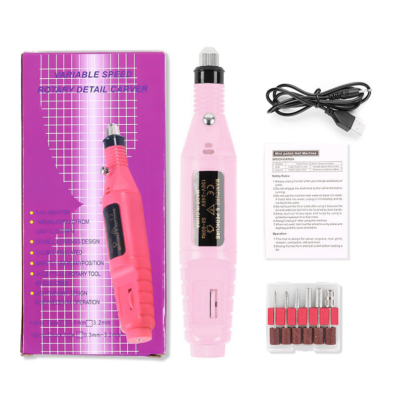 Pink variable speed rotary tool with packaging, cable, and attachments on a white background