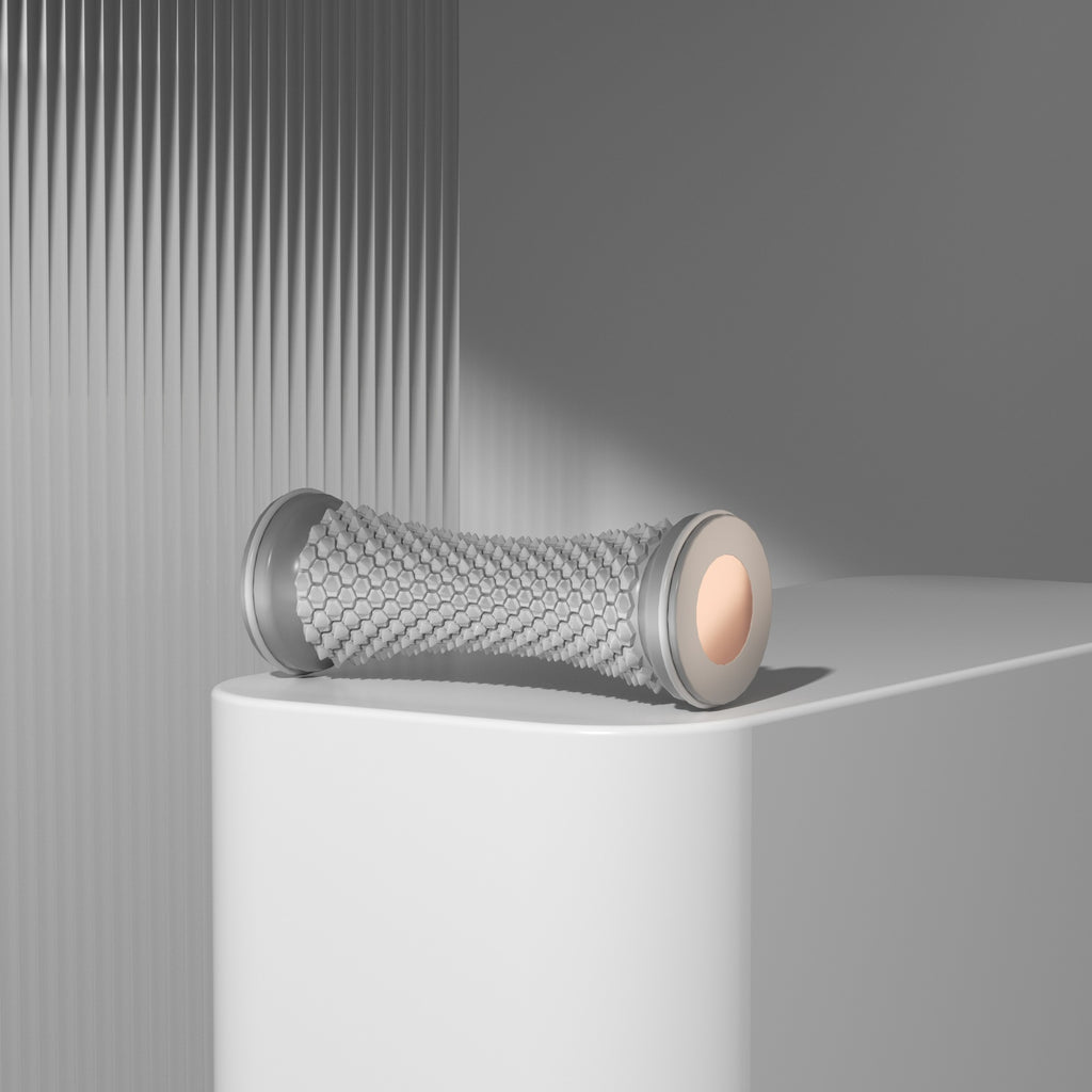 Foot massage roller used during a yoga recovery routine