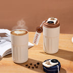 Insulated travel coffee tumbler with temperature display