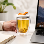 Portable glass tea tumbler for loose-leaf tea at an office desk