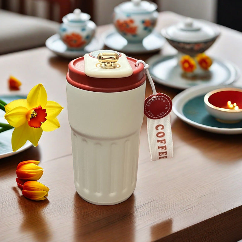 Temperature display tumbler for tea and warm drinks